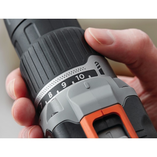 Close-up photo of BLACKDECKER drill BCK21S1S showing adjustable torque settings and black, gray, orange details.