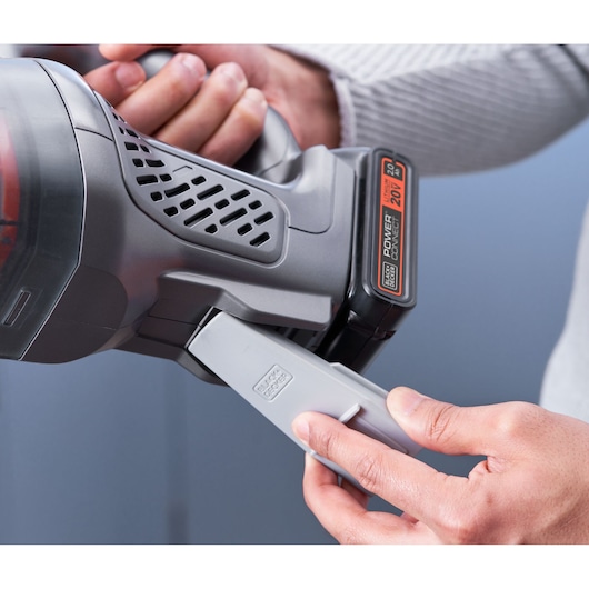 Close-up photo of BLACKDECKER BCHV001D1 handheld vacuum cleaner, showing battery installation and handle.