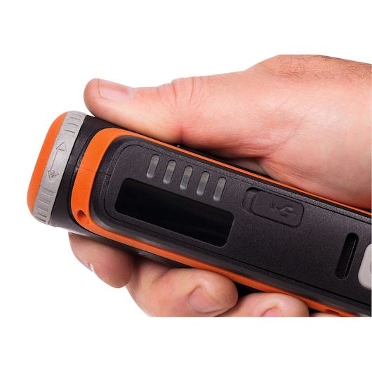 Close-up photo of BLACKDECKER BCRT8K35 black and orange handheld device with USB port and LED indicators.