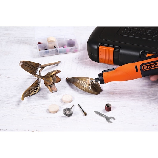 BLACK+DECKER BCRT8K35 rotary tool kit with orange handle, various accessories, and carrying case, photo from above.
