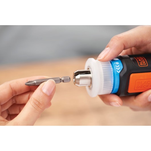 BLACKDECKER BCRTA601I screwdriver with bit being inserted, close-up view in hand.