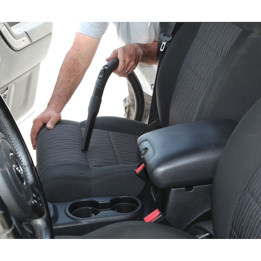 BLACKDECKER BDWD10 vacuum cleaner nozzle cleaning car seat upholstery, front interior view.