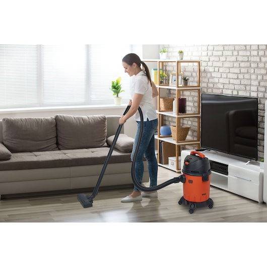 Photo of BLACKDECKER BDWD20 wet and dry vacuum cleaner in use on living room floor.