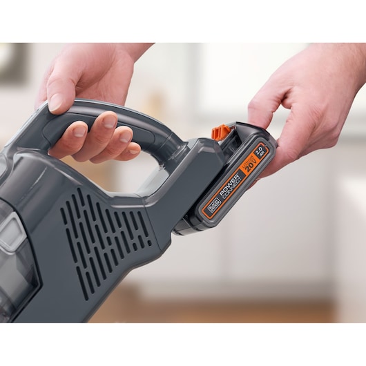 Photo of BLACKDECKER cordless handheld vacuum BHFEA18D1, close-up of handle and removable battery.