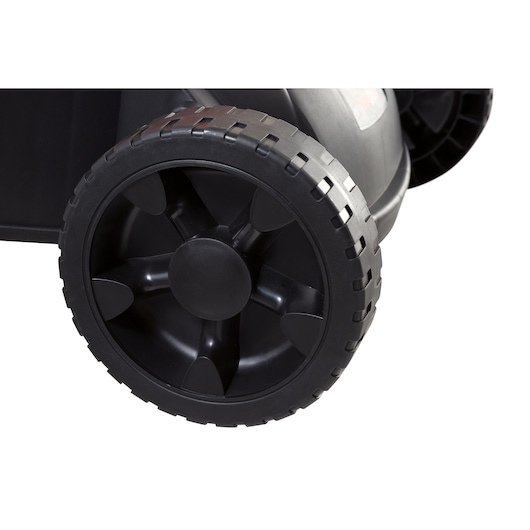 BLACKDECKER GR3800 lawn mower close-up of black plastic rear wheel, white background.