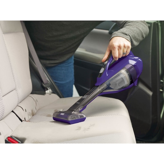 BLACKDECKER HLVA325JP07 purple handheld vacuum cleaning car seat upholstery.